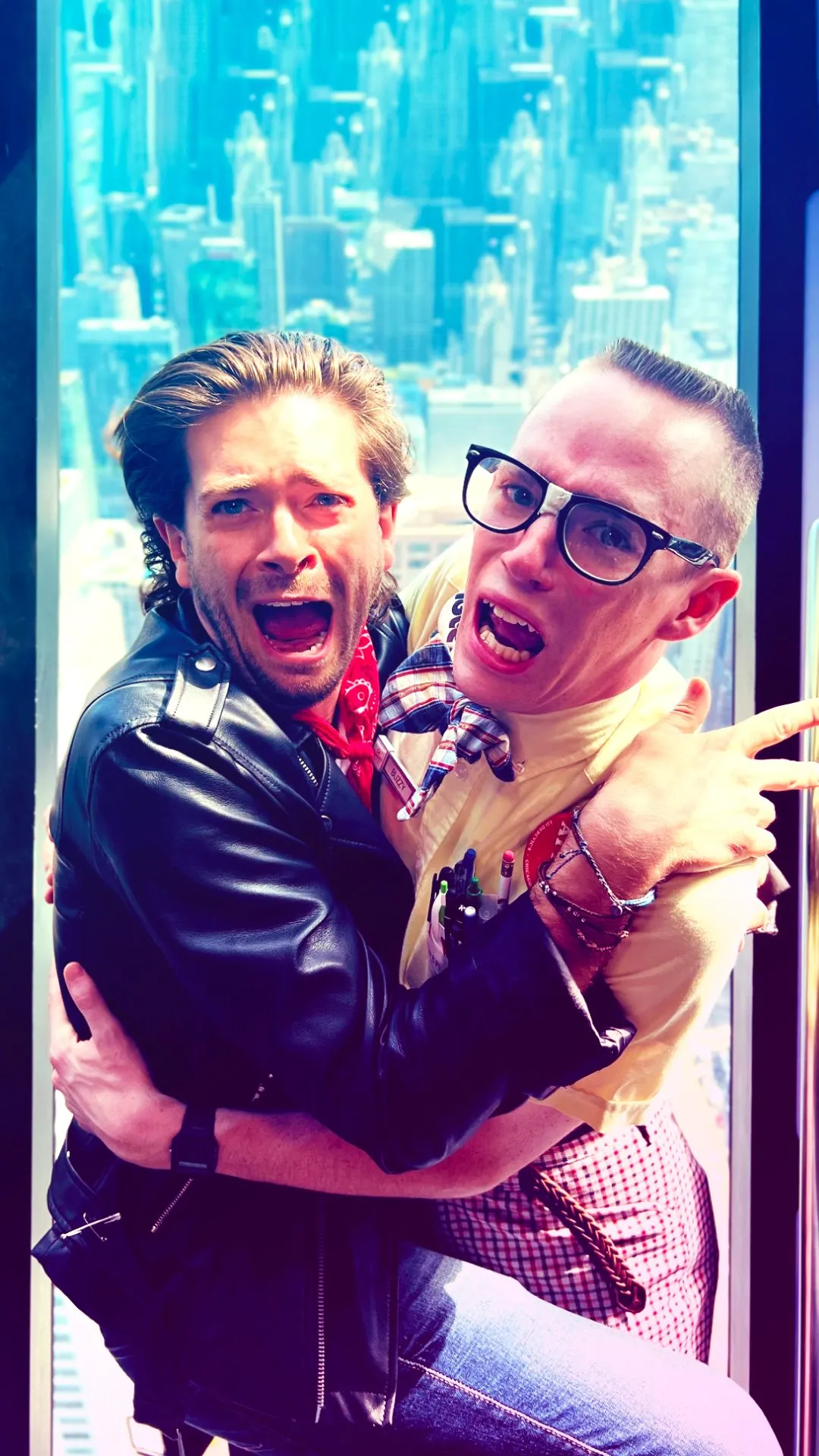 Skip and Buzzy clutching each other at the 360 Chicago Tilt